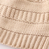 Beige pompom cable beanie hat