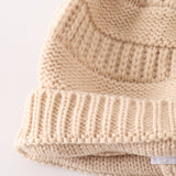 Beige pompom cable beanie hat